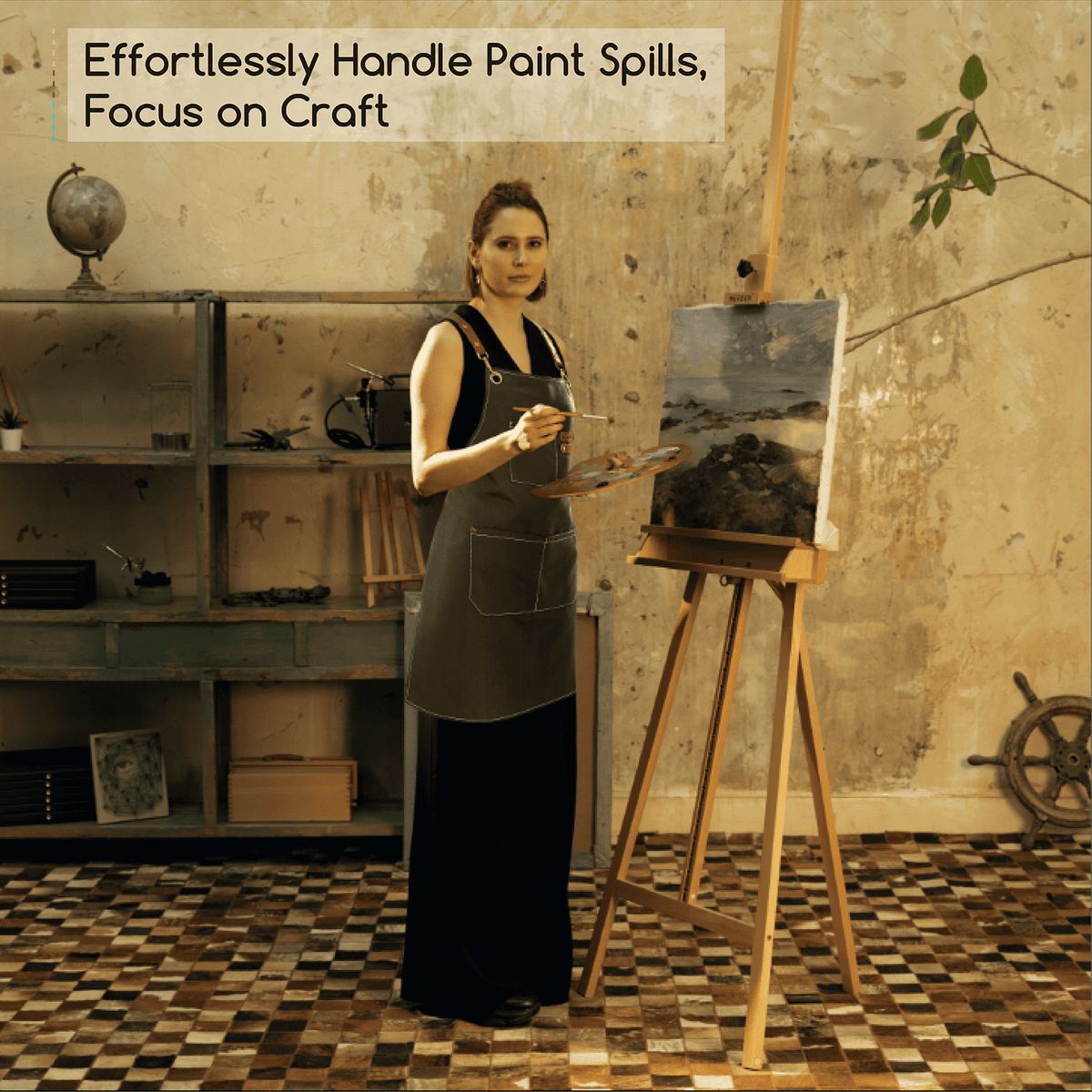 Black MEEDEN painting apron with pockets, worn by a model