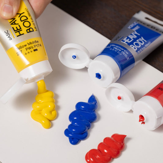MEEDEN heavy body acrylic paint squeezed from yellow, blue and red tubes